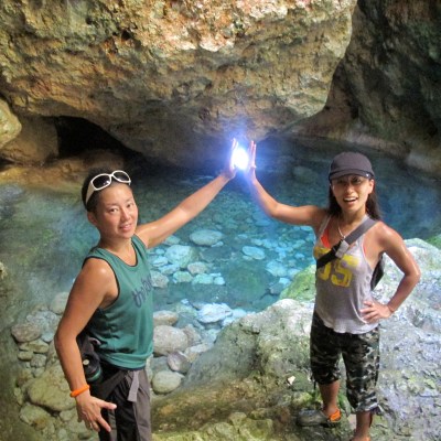 Two people high-fiving at the forbidden pool