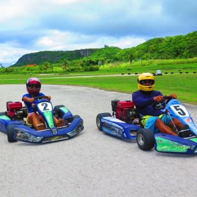 Two people drinking go karts