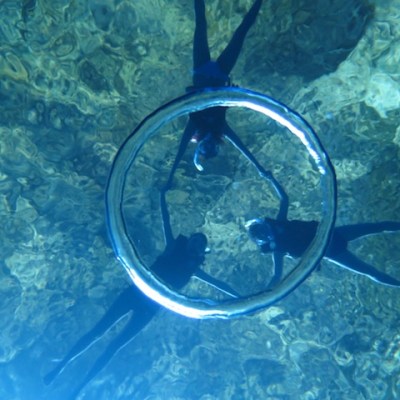 A group of guests playing with a bubble ring