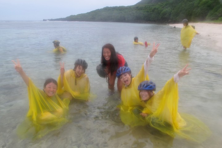 A bunch of guests playing in the ocean