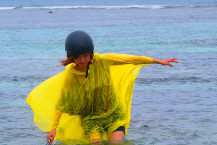 A guests wading through some water on a rainy day