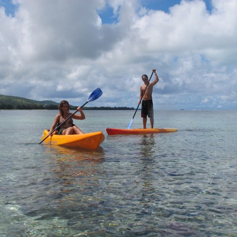 A man on his SUP and a woman in a kayak